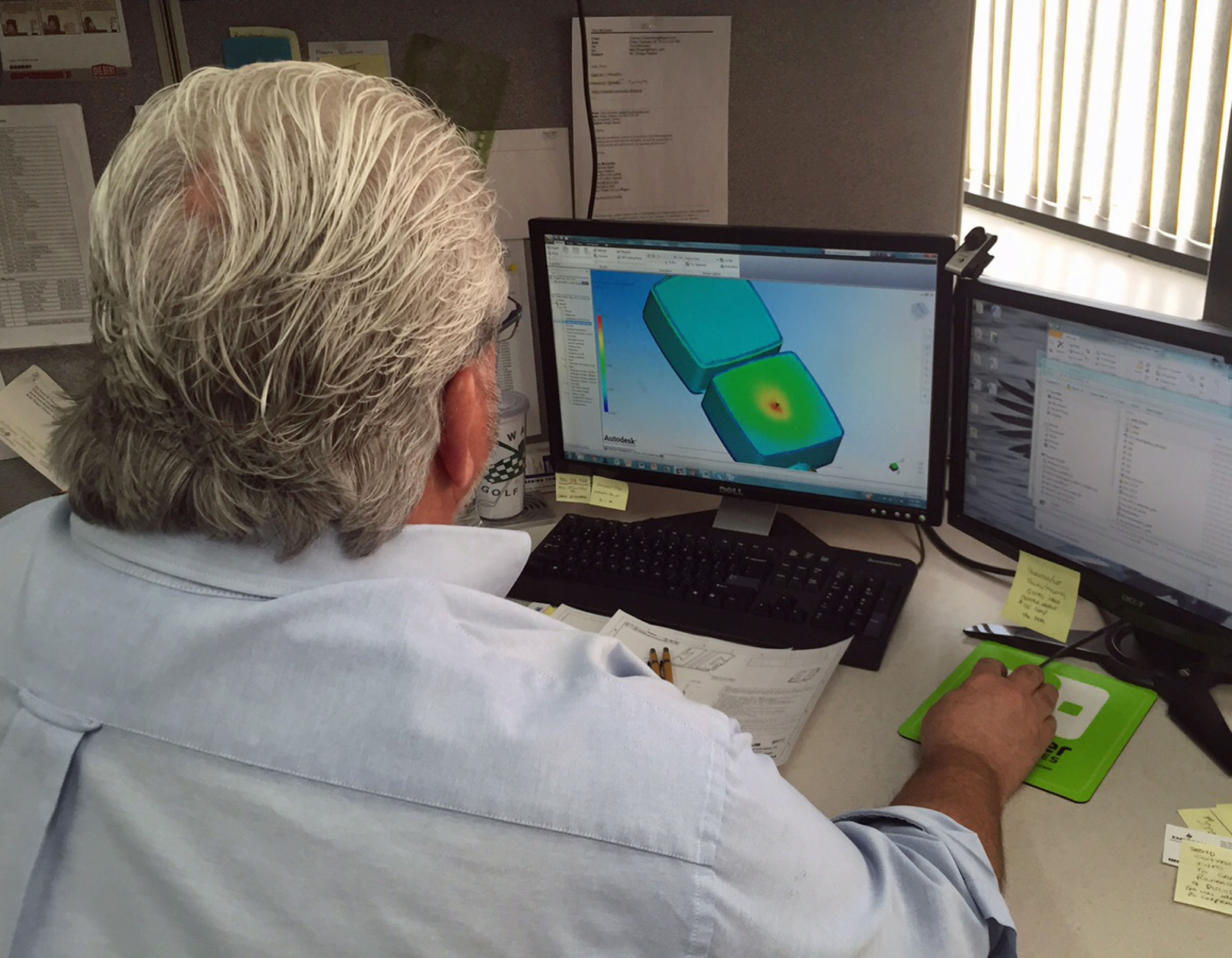 designer reviewing injection molding guidelines